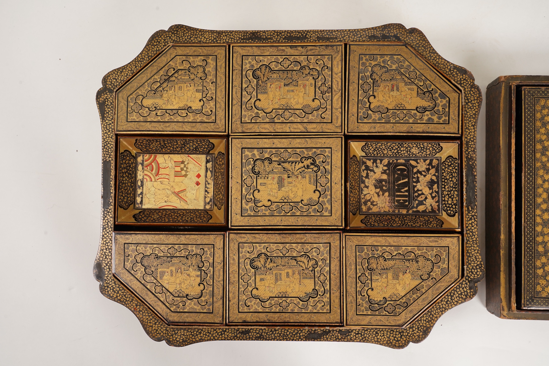 Two Chinese gilt decorated black lacquer games boxes, containing numerous mother-of-pearl counters, 19th century